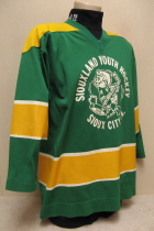 The green jersey with the old little joe logo screened on and Sioux City Iowa on the back were  PeeWee A travel jerseys during the 85-86 season. I believe they were used for a few seasons before that. 